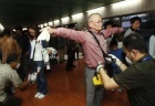 Members of the Indonesia Nuclear Energy Regulatory Agency (BAPETEN) scan passengers arriving from Japan for radiation exposure at the Sukarno-Hatta airport in Jakarta March 18, 2011.