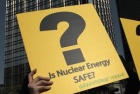 Anti-nuclear protesters hold signs at a rally organized by Greenpeace to demand the government immediately stop the expansion of nuclear power offered by mainland China in Hong Kong April 24, 2011. REUTERS/Tyrone Siu 