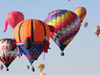 A cluster of color fills the sky during the first mass ascension at the 41st annual Albuquerque International Balloon Fiesta.