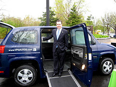 Congressman Boren checks out a handicap accessible vehicle powered by natural gas.