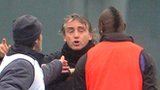 Mario Balotelli (left) and Roberto Mancini