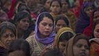 Indian women offer prayers for a gang rape victim at Mahatma Gandhi memorial in New Delhi, India (2 Jan 13)