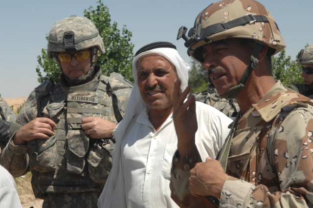 Lt. Col. Drew Meyerowich and Iraqi Army Lt. Col. Abbul Rahmad meet with a village leader.