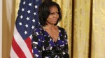 PHOTO: First lady Michelle Obama stands on stage during an awards ceremony for the President's Committee on the Arts and the Humanities in the East Room at the White House on November 19, 2012 in Washington, DC.