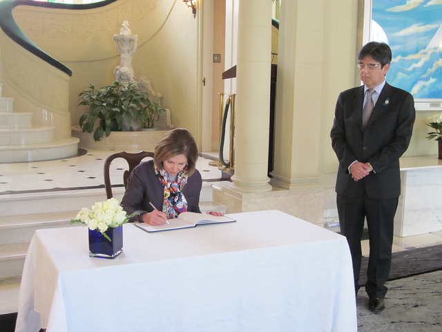 Leader Nancy Pelosi signing the book of condolences at the consulate of Japan in San Francisco