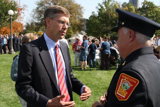 Speaking with local firefighters at the dedication of the new Minnesota Firefighters Memorial