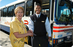 image of a Metrobus operator with a rider