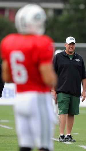 New York Jets head coach Rex Ryan keeps an eye on New York Jets quarterback Mark Sanchez #6 when the New York Jets held training camp Monday, August 13, 2012 at SUNY Cortland in Cortland, New York.  (Robert Sabo/New York Daily News)