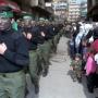 FILE--Shiite Muslim residents watch militants of the Iranian-backed Hezbollah, or Party of God, with faces painted black, during a parade in south Beirut in this Feb 16, 1996 file photo. Muslim militants observe Quds Day annually on the last Friday of Islam's holy month of Ramadan to protest the 1967 Israeli occupation of Jerusalem's Arab sector. Al-Quds is the Arabic name for Jerusalem. Ramadan's holiness never stopped Iraqi Muslims from shooting at Iranians in the 1980s or Egyptian Muslims from gassing Yemenis in the 1960s. Yet U.S.-allied Muslim leaders are suggesting a cease-fire for the month.(AP Photo/Ali Mohamed)   Original Filename: ATTACKS_GUNS_OF_RAMADAN_WX105.jpg