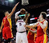 Hawks forward Josh Smith has his shot blocked from behind by Rockets point guard Jeremy Lin. (AP Photo/Bob Levey)