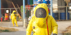 People in chemical protective gear responding to chemical emergency