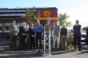 Ron, local officials and the owners of Café Yumm! in Eugene dedicate the café’s new electric car charging stations.