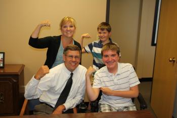 Rep. Paulsen chats with Jason, Jake, and Lynn of Plymouth regarding the impact of neuromuscular disease in our community.