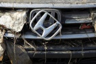 A Honda logo on a car is seen at Sendai airport which was damaged by the March 11 earthquake and tsunami, in Natori, Miyagi Prefecture April 1, 2011. REUTERS/Toru Hanai 