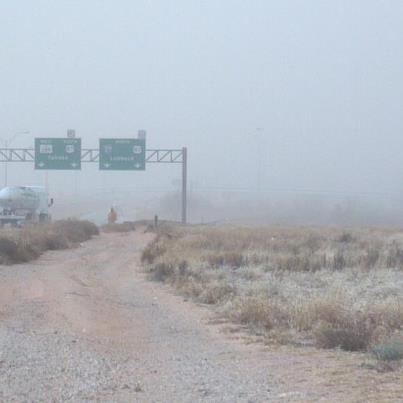 Photo: Frank Romanofski, who works in TxDOT's Lubbock District Lab, is barely distinguishable as he worked on South Loop 289 just minutes after the dust storm hit. Motorists, please proceed through the area with caution and drive to conditions.