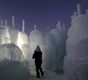 A man and his child walk through the 20-foot high Ice Castle at the Mall of America in Bloomington, Minn. on Monday, Dec. 31, 2012. 