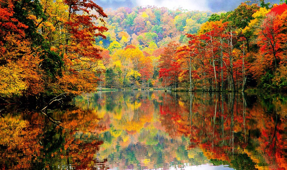 Beavers Bend State Park puts on a majestic show as its spicy fall colors reflect on the smooth-as-glass surface of the water.