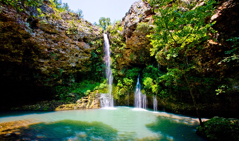 Pack a picnic and descend into a narrow valley to see this peaceful 77 ft waterfall at Natural Falls State Park.