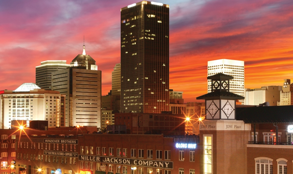 The downtown Oklahoma City skyline is drenched in the spectacular colors of an Oklahoma sunset.