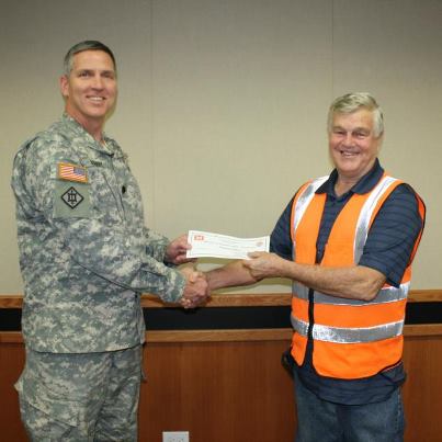 Photo: Rockwell "Rocky" Rogers, Construction Control Representative, Schofield Barracks Area Office is presented his award as Employee of the Month for November 2012 by District Commander Lt. Col. Thomas D. Asbery for Rogers' outstanding leadership and exceptional technical skills in managing the construction quality assurance (QA) program on the Battle Area Complex (BAX), Schofield Barracks project.  Job well done and Congratulations.— at Fort Shafter Army Base.