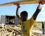 Date: 11/10/2010 Description: Workers prepare materials for transitional shelters in Leogane, Haiti. © USAID Image