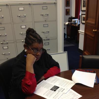 Photo: Reading the most recent fiscal cliff news and potential deals. We must come together to help working families now!