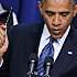 Photo - WASHINGTON, DC - NOVEMBER 28:  U.S. President Barack Obama holds a pen while saying he is ready to sign legislation taht would extend tax cuts for middle class people during an event in the Eisenhower Executive Office Building November 28, 2012 in Washington, DC. With the end-of-the-year "fiscal cliff" looming over lawmakers in Washington, Obama will meet with 14 chief executives at the White House later in the day.  (Photo by Chip Somodevilla/Getty Images)