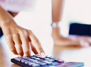 Woman's hand using a calculator