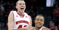 Wiscosin's Jared Berggren, left, and George Marshall celebrate a three-point basket by teammate Ben Brust 