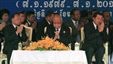 Cambodian Prime Minister Hun Sen, right, prays with President of the Cambodian National Assembly Heng Samrin, left, and Senate President Chea Sim, center, during a celebration marking the 34th anniversary of the 1979 downfall of the Khmer Rouge regime, in Phnom Penh, Cambodia, Monday, Jan. 7, 2013. (AP Photo/Heng Sinith)