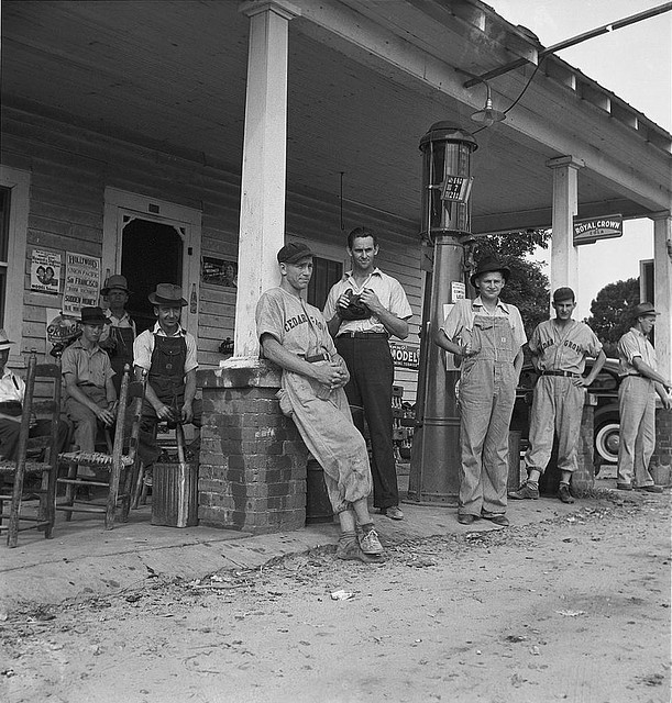 Fourth of July, near Chapel Hill, North Carolina. Rural filling stations become community centers and general loafing grounds. The men in the baseball suits are on a local team which will play a game nearby. They are called the Cedargrove Team (LOC)