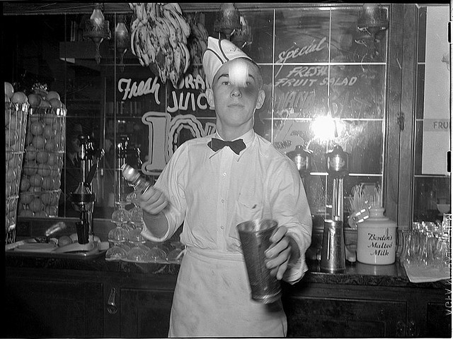 Soda jerker flipping ice cream into malted milk shakes. Corpus Christi, Texas (LOC)