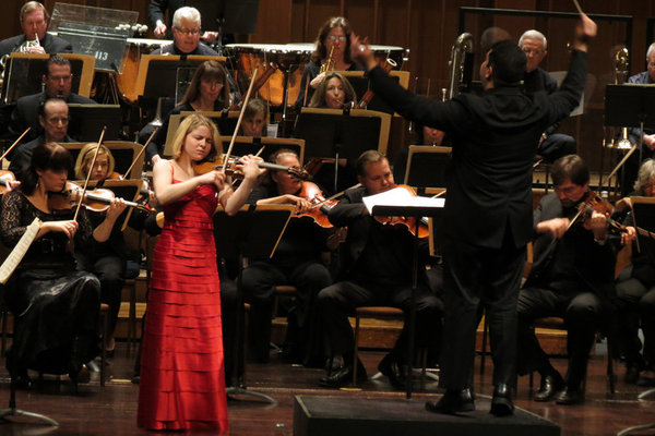 Violinist Caroline Goulding plays with the Pasadena Symphony Orchestra, conducted by Tito Munoz at the Ambassador Auditorium.