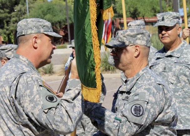 Brig. Gen. Scottie D. Carpenter, briefly talks to Lt. Col. Theodore Hawkins, the 387th Military Police Battalion commander, during the activation ceremony held in Scottsdale, Ariz., on Sept. 29. Carpenter is the 11th Military Police Brigade commander, which is subordinate brigade to the 200th Military Police Brigade.