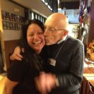 Photo: "A photo of Historic Statesmen Vic Fischer and me. I work at the Sitka Historical Society Museum and operate the Museum Gift shop. I was so enamored with him, I couldn't contain myself.  I wish cherish the photo forever." 
 Photo taken by Vic Fisher's wife Jane Anvik.