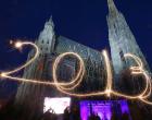 A young woman writes with a sparkler the number 2013 in the air near St. Stephen's Cathedral in Vienna, Austria, 31 December 2012, as many locals and tourists gather to celebrate New Year's Eve.