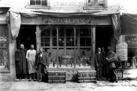 A 19th century shoe store in Richmond, Virginia had an operable awning retracted against the building facade.  Hinged extension arms were raised and lowered allowing for an awning configuration easily changed in response to weather conditions.  This photo shows how the fabric gathered and was exposed to the elements when retracted - part of the reason roller awnings later became prevalent. Photo: Library of Congress, Prints and Photographic Division, LC-USZ62-99053.