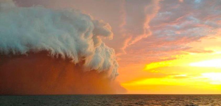 Photo: Amazing: A white shelf cloud caps brownish dirt from a dust storm, or haboob, as it travels across the Indian Ocean near Onslow on the Western Australia coast earlier this week. (Credit: Reuters/Brett Martin/fishwrecked.com)

http://www.theatlantic.com/infocus/2013/01/summer-down-under/100437/
