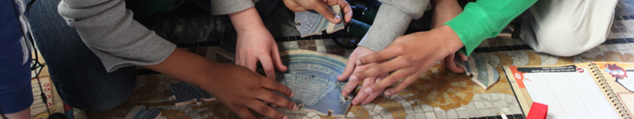 Students examine mosaic floor