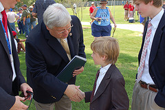 Rep. Marchant shaking hands with a young constituent