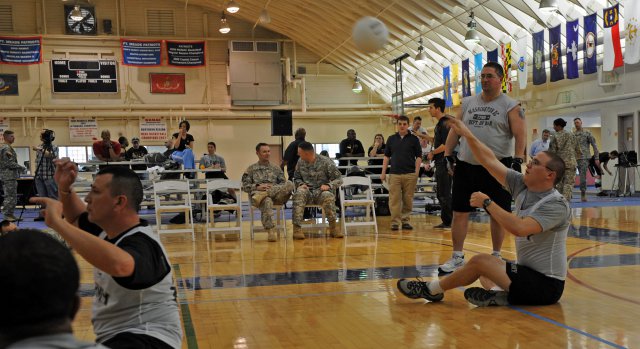 Spc. Jonathan Schmidt, with the Fort Meade, Md., Warrior Transition Unit, volunteered to compete against 2012 Warrior Games competitors during a sitting volleyball clinic, March 9-12, 2012.