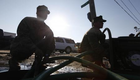 Marines pump water in Breezy Point, N.Y.