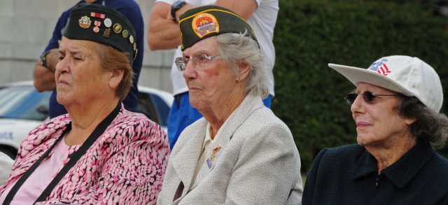 Army veterans listen to guest speakers at the 15th anniversary of the dedication of the Women in Military Service for America Memorial at Arlington National Cemetery, Va., Oct. 20, 2012.