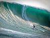 Picture of Greg Long surfing an enormous wave at Pico Alto, Peru