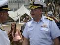 Commander, Coast Guard District 5 chats with Commander, Carrier Strike Group 2