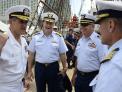 Coast Guard Rear Adm. Steve Ratti and Navy Rear Adm. Greg Nosal enjoy a social moment together