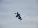 Blue Angels 1, 2, 3 and 4 are lined up wing to wing over Baltimore Harbor