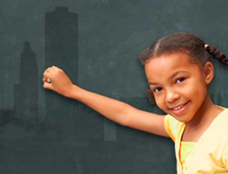 Child writing on a chalkboard