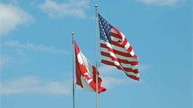 US and Canada Flags Flown Together - Photo by Joel Dinda