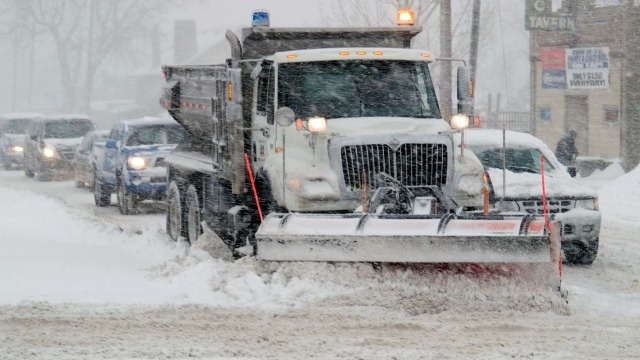Snow plow during storm - Photo by FEMA/Michael Rieger
